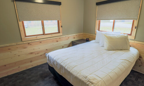 Cabin interior with queen bed