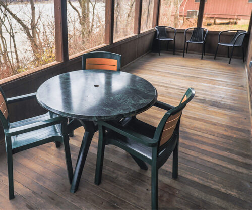 Cabin deck with table and chairs
