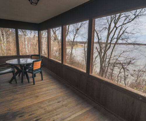 Upgraded porch furniture is perfect for sitting and enjoying the nature at Deer Creek