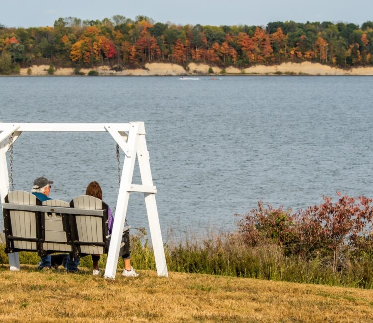 Couple sitting at lake