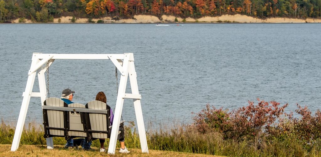 Couple sitting at lake