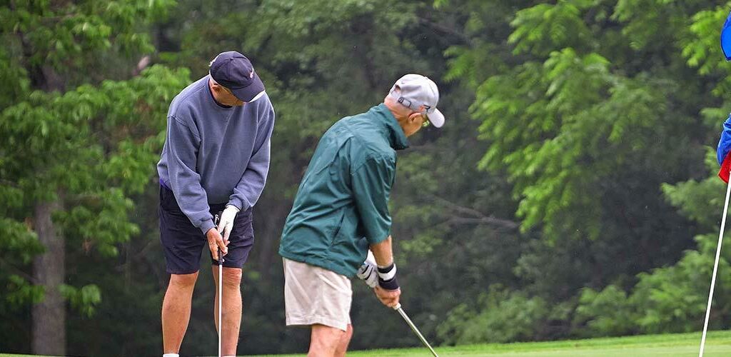 People golfing