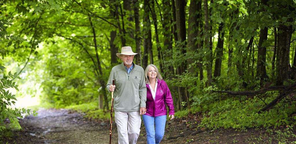 Couple Hiking In Woods