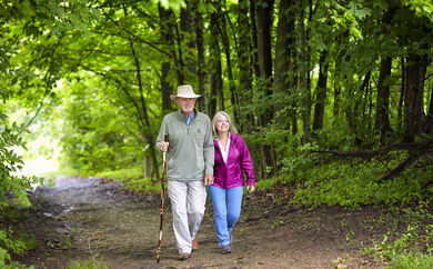 Couple Hiking In Woods